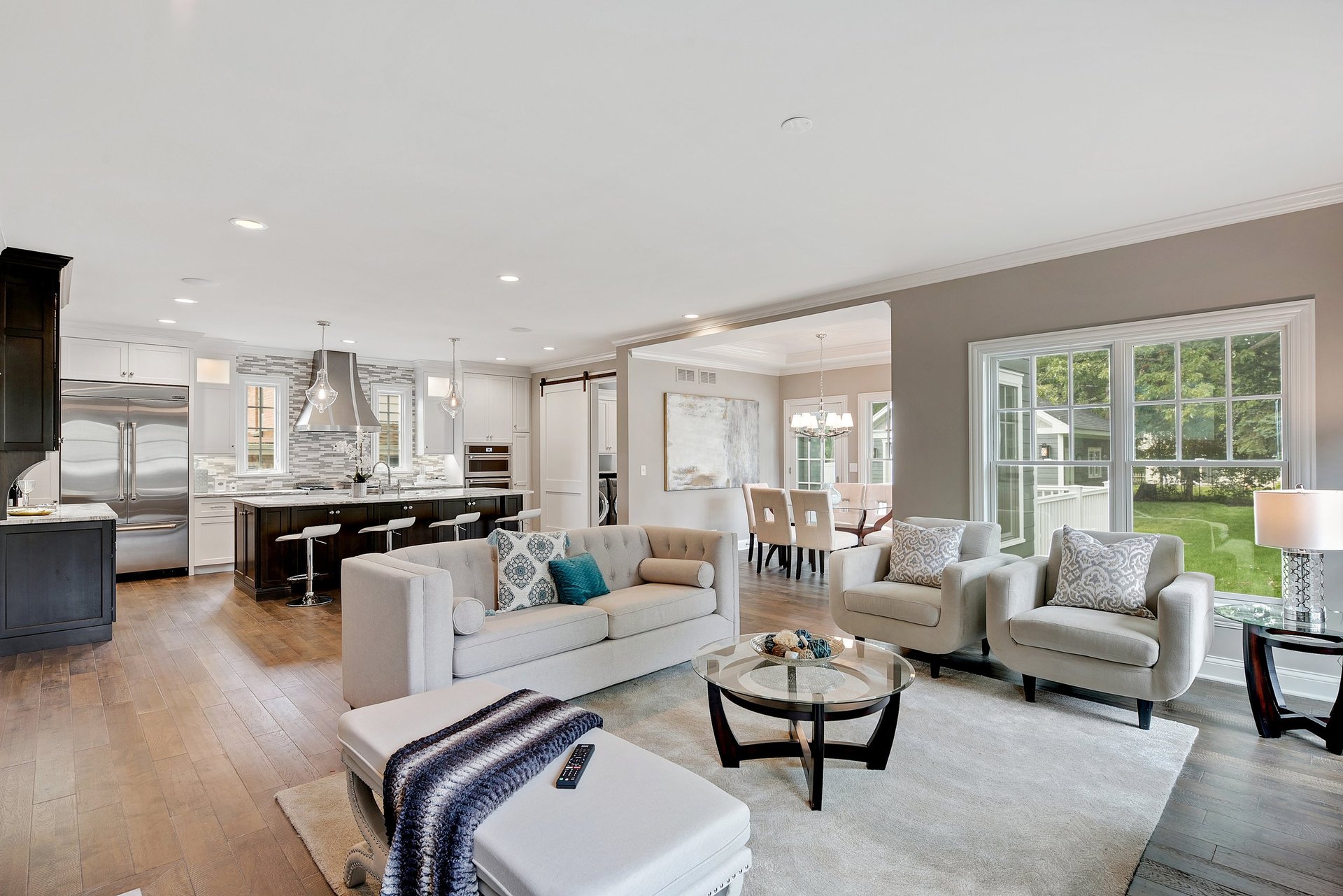 Bright modern great room and kitchen in an upscale residential townhome