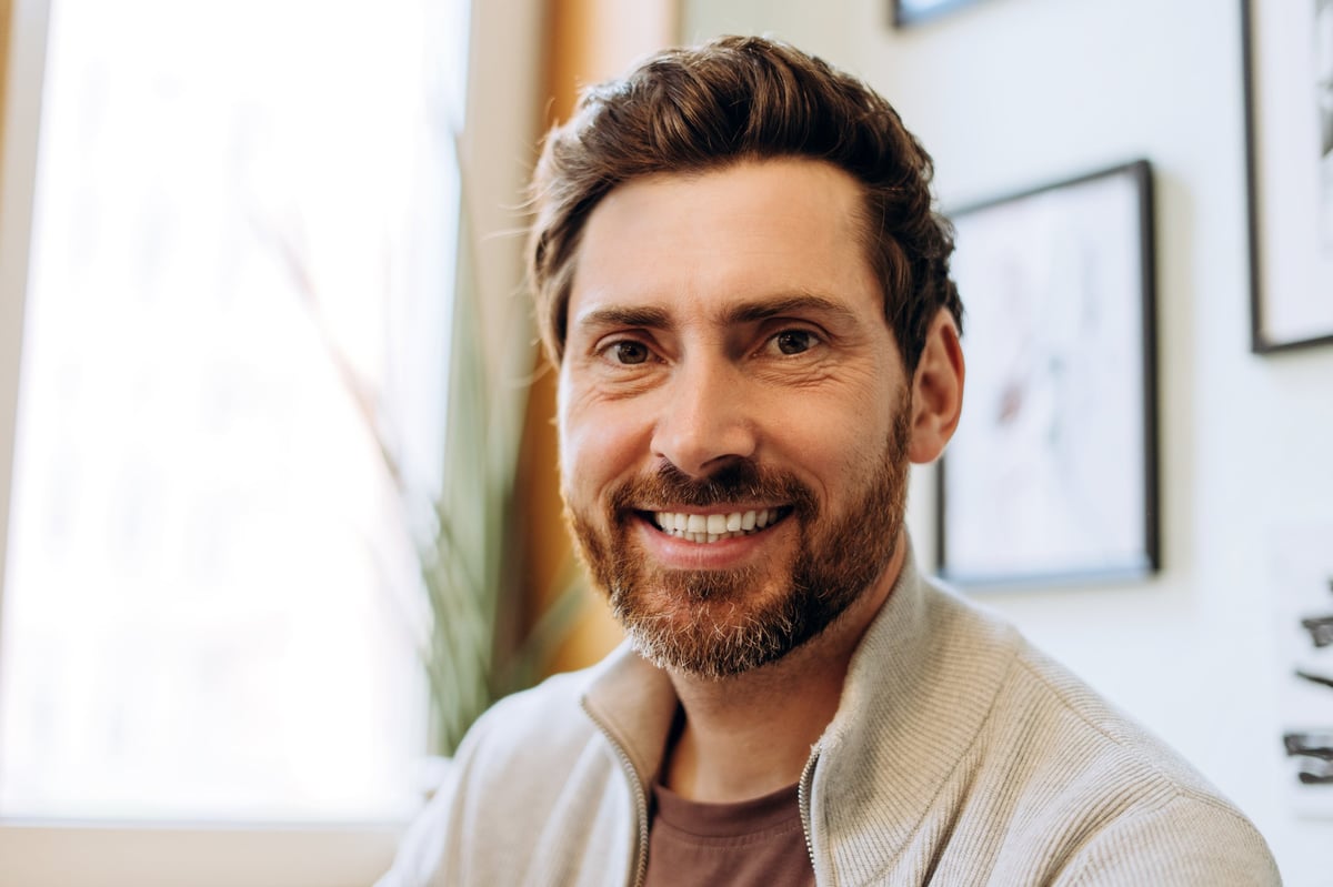 Portrait of a mid-adult businessman smiling confidently
