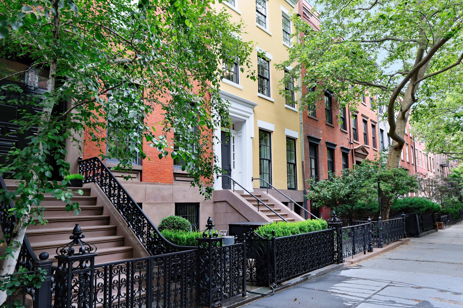 Attractive starter brownstone townhomes in a residential neighborhood near a college campus