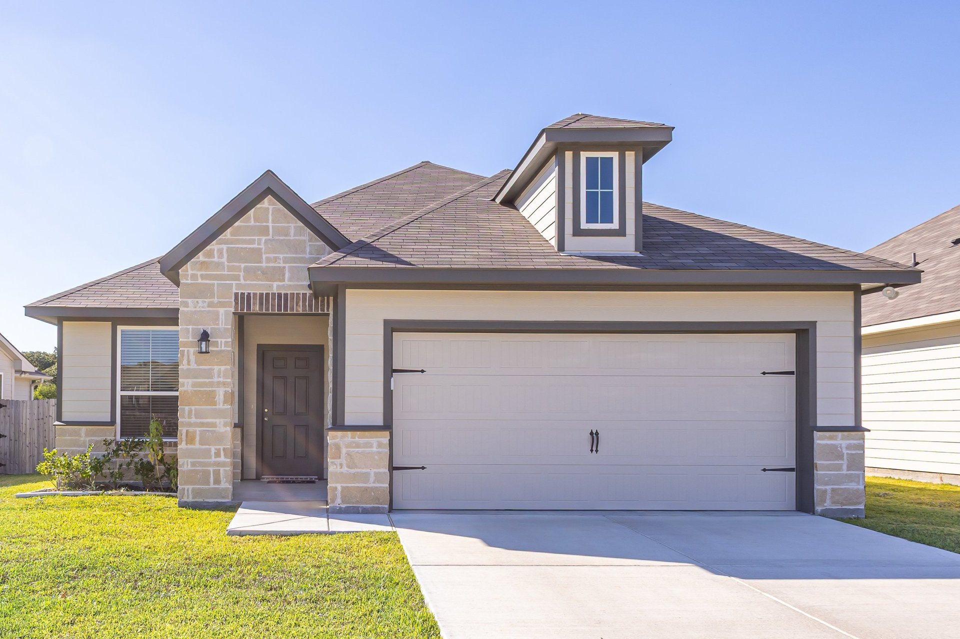Attainable single-family rental home with double garage and landscaped yard used for a DSCR purchase scenario